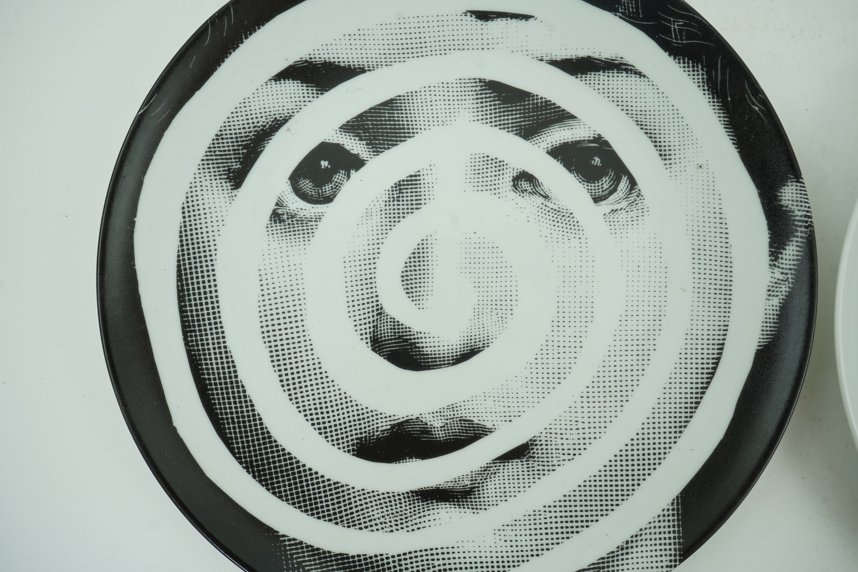 Piero Fornasetti (Italian, 1913-1988): Two 'Tema a Variazioni' plates